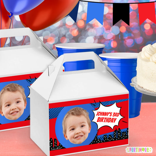 Custom action packed red and blue comic style gable box labels with city skyline style, perfect for adventure birthday party favor boxes, comic hero decorations, and kids’ party supplies
