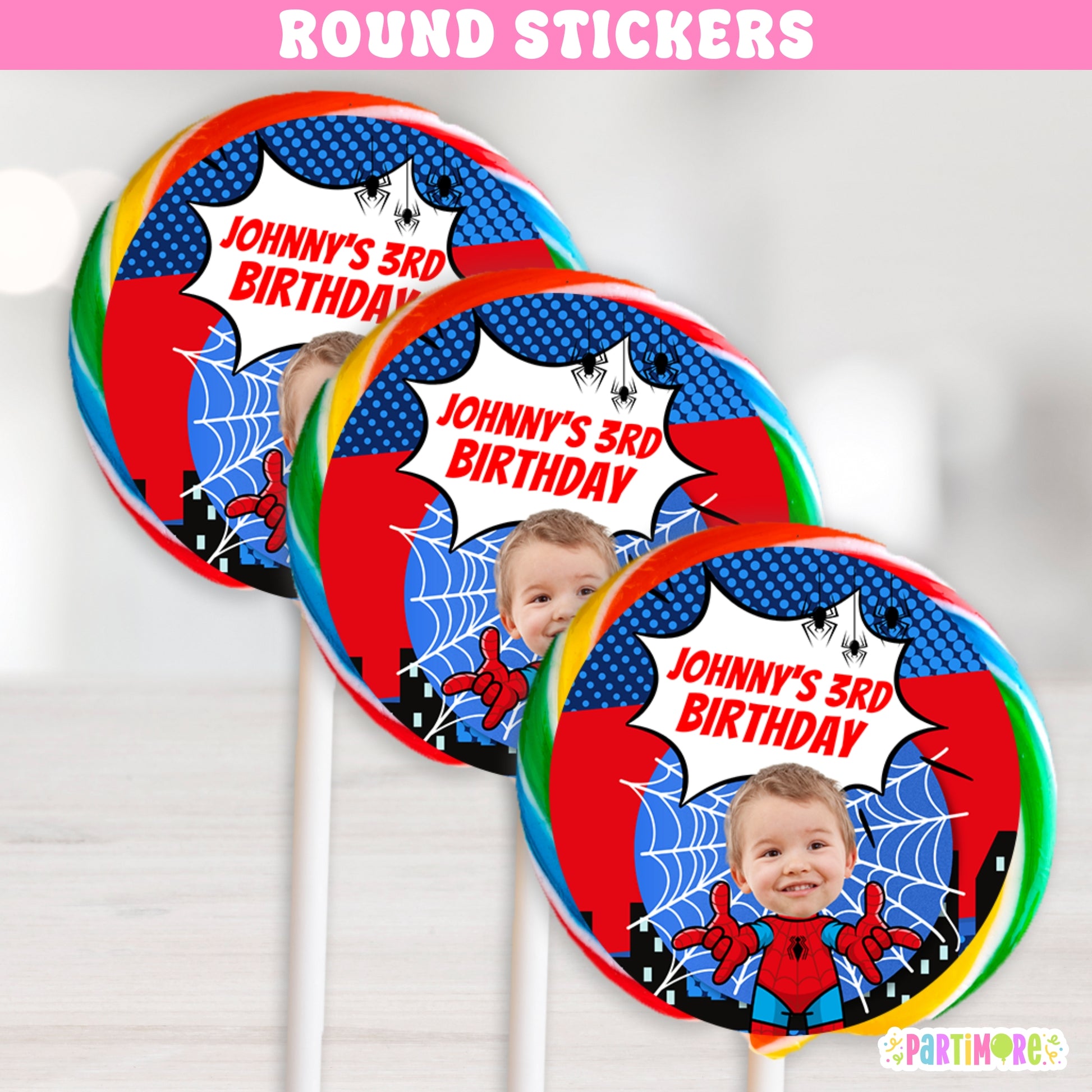 Custom superhero round sticker labels with city skyline and web design, perfect for lollipop favors, party bags, and comic hero birthday party decorations