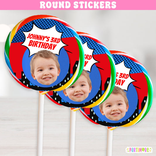 round birthday party stickers featuring a comic book style design with red and blue design, a white speech bubble, and a child's face.