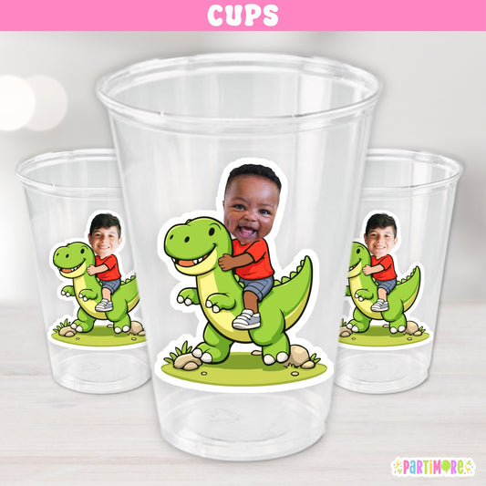 Set of 12 personalized 16 oz dinosaur birthday cups featuring a custom child photo riding a green dinosaur for kids dino parties